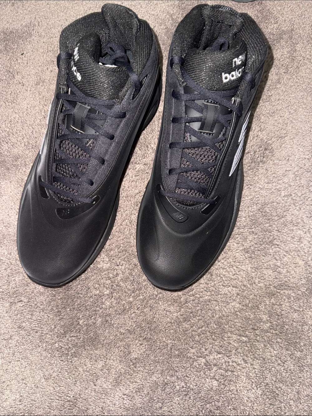 New Balance Men's Black Athletic Shoes with Subtle Silver Logo